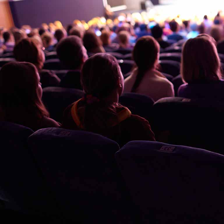 Audience sitting in a theatre