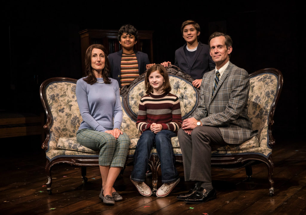 Preetish Chakraborty, Leo Gonzalez, McKinley Carter, Stella Rose Hoyt and Rob Lindley seated around a couch posing for a family photo